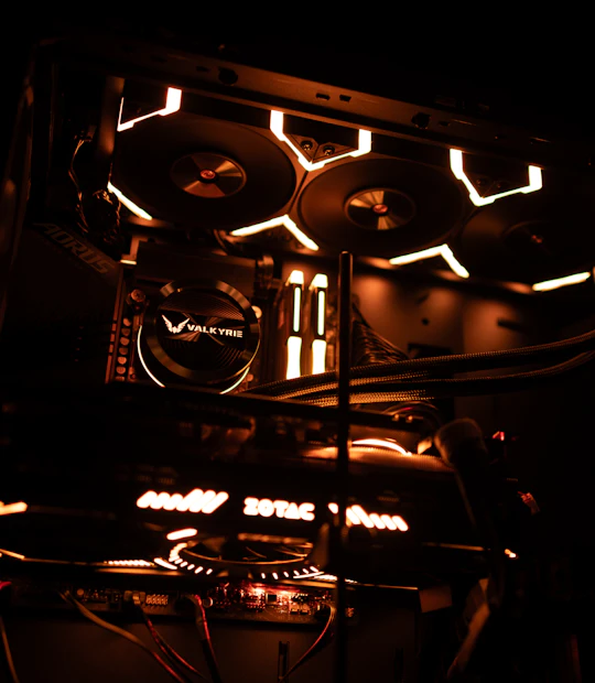 AIO liquid cooling pump block glowing orange inside a custom build